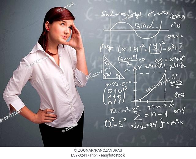 Beautiful school girl thinking about complex mathematical signs