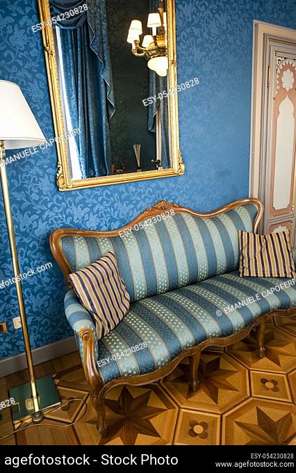 Corner sofa in a luxury room at the Hotel Villa Crespi in Orta San Giulio, Piedmont, Italy