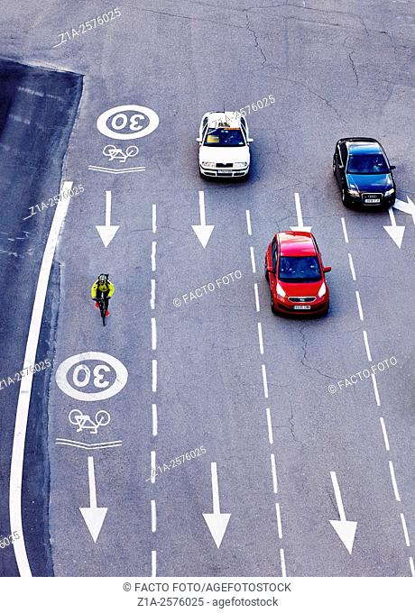 Cycle lane sharing the road traffic at Cibeles square. Madrid. Spain