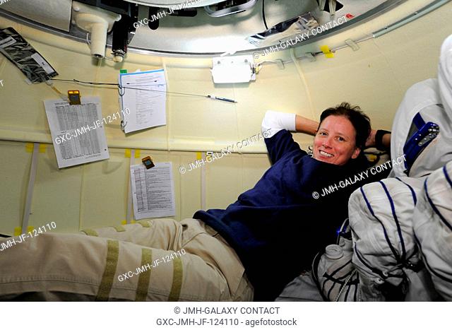 NASA astronaut Shannon Walker, Expedition 24 flight engineer, is pictured in the orbital module of the Soyuz TMA-19 spacecraft while docked to the Zvezda...