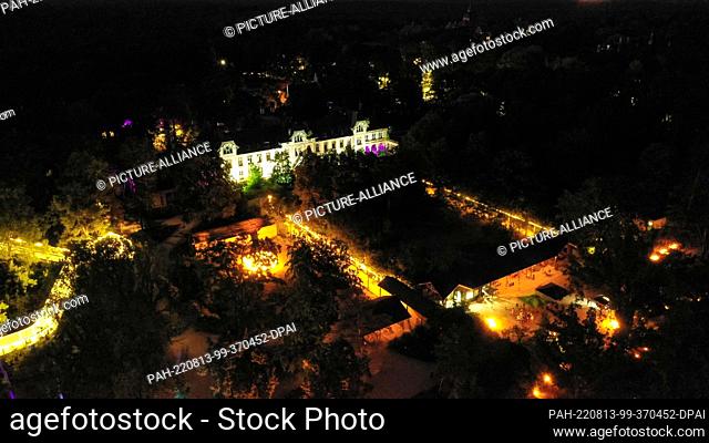 12 August 2022, Brandenburg, Beelitz-Heilstätten: The drone shot shows the light installations for the ""Long Nights at the Treetop Trail"" campaign in...