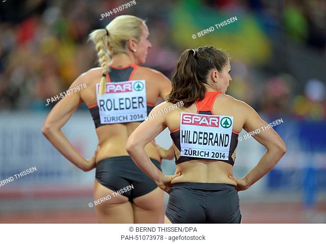 Cindy Roleder (L) and Nadine Hildebrand of Germany compete in the women's 100m hurdles final at the European Athletics Championships 2014 at the Letzigrund...
