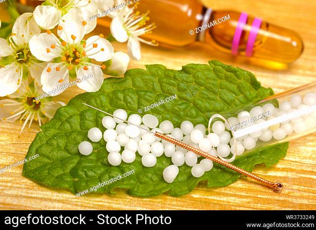 alternative medicine with herbal pills and acupuncture