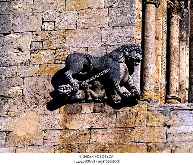 Church of San Pedro de Besalu, lion protecting a human figure and decorating the front window of ?