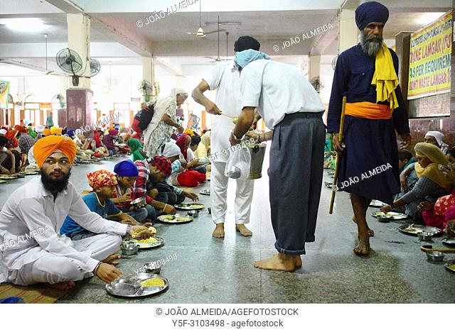 The langar at Golden temple at Amritsar, where 60000 free meals are served everyday, and that mostly relies on volunteers to run it