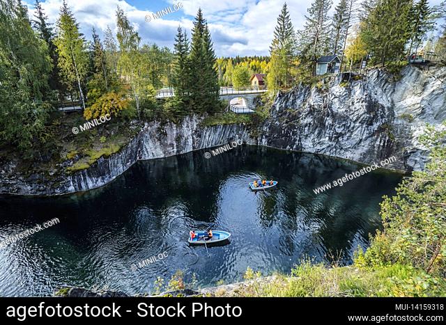 pleasure boat in marble canyon in the mountain park of ruskeala, karelia, russia