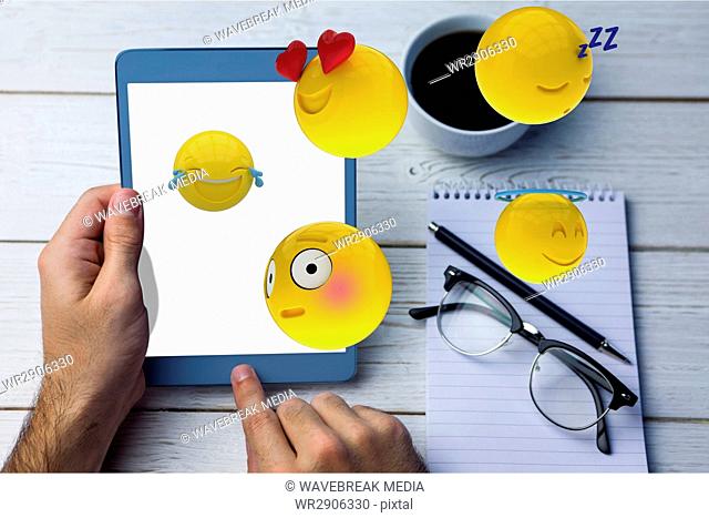 Composite image of tablet and smileys