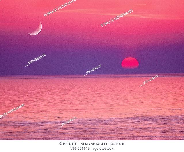 Moon and setting sun over Straits of Juan De Fuca, from San Juan Island, Washington State, USA