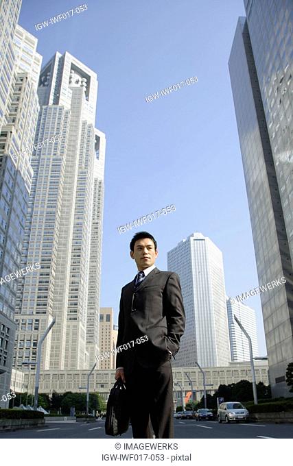 Businessman amid office buildings
