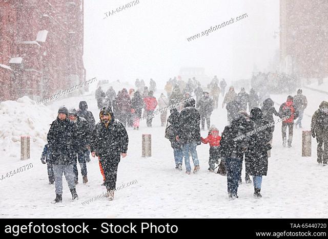 RUSSIA, MOSCOW - DECEMBER 3, 2023: People walk in Red Square durng a snowfall. Vyacheslav Prokofyev/TASS