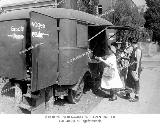 The picture from a Nazi news report shows a replacement dairy wagon - after the store was destroyed during a bombing - from the Vereignigte Pommerschen...