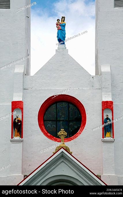 Statues on the facade of white catholic church in Apia, Samoa