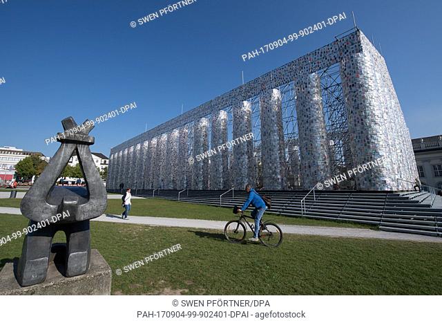 Forbidden books wrapped in plastic hang on the finalized documenta artwork 'The Parthenon of Books' in Kassel, Germany, 4 September 2017