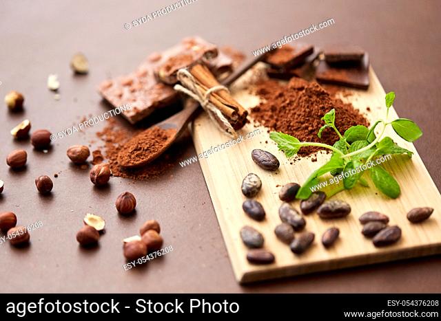 chocolate with nuts, cocoa beans and cinnamon