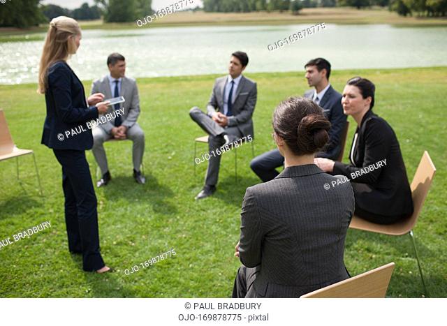 Business people having meeting outdoors
