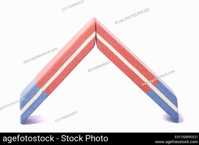 Close up view of a blue and red eraser isolated on a white background