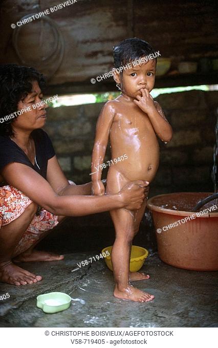 Bath time, Malay village. Cameron Highlands regions, Malaysia