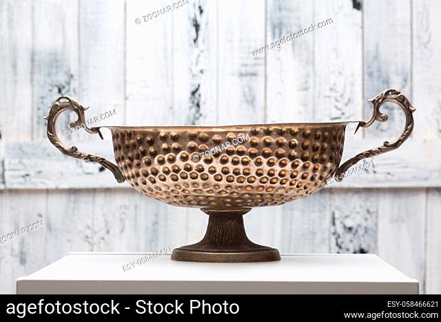 Accessories for sound massage. Tibetan singing bowl treatment. Bronze ancient cauldron isolated over white background