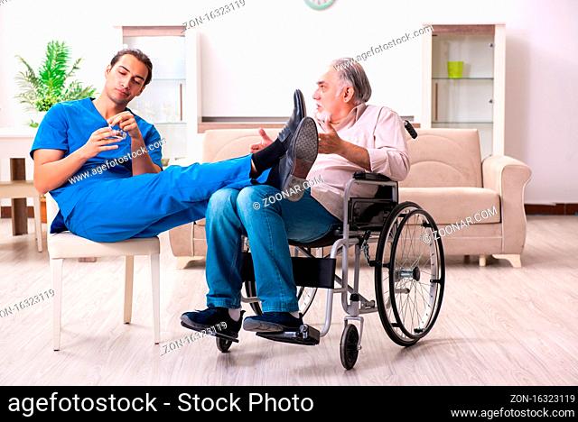 Old man in wheel-chair and bad caregiver indoors