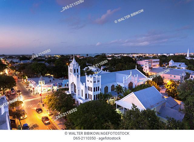 USA, Florida, Florida Keys, Key West, St. Paul's Episcopal Church and Duval Street, elevated view, dusk
