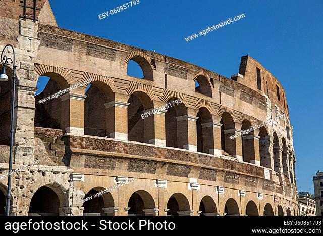 Colosseum in Rome from ground level along the old Roman Road during morning hours, bright and light. Italy, Landmark, Colloseum