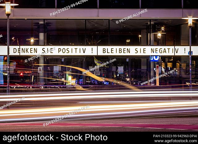23 March 2021, Lower Saxony, Hanover: The writing ""Think positive! Stay negative!"" can be read above the entrance area of the ""Theater am Aegi""