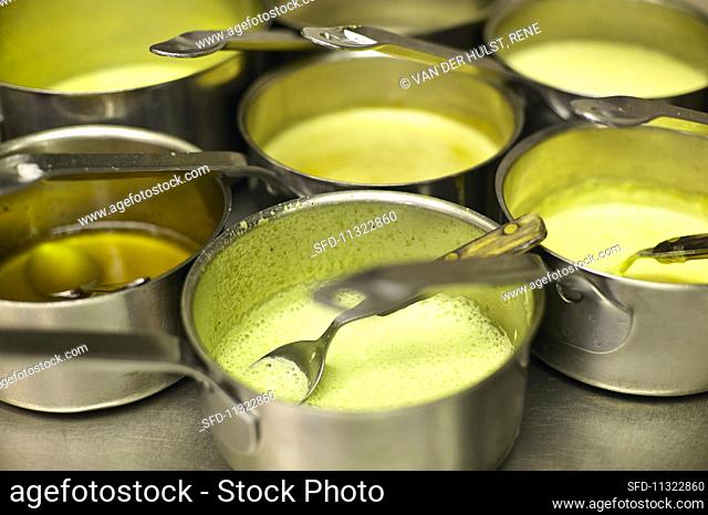 Saucepans of soup in a commercial kitchen