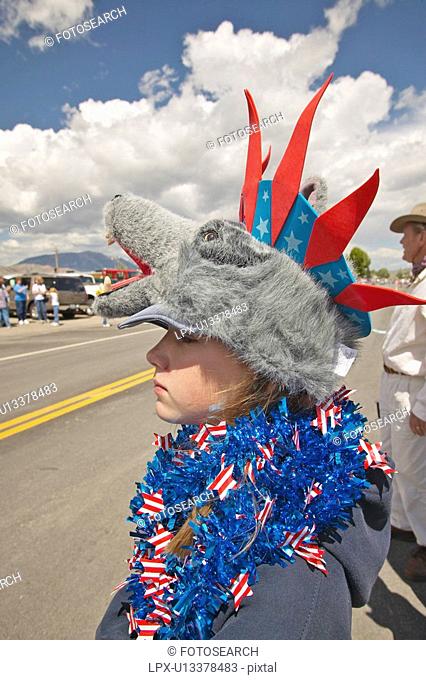 Child wearing unusual headgear for the Fourth of July Parade