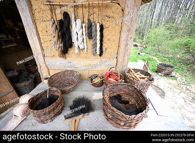 PRODUCTION - 29 April 2022, Baden-Wuerttemberg, Meßkirch: Utensils and accessories on a loom at the monastery construction site Campus Galli on which fabrics...