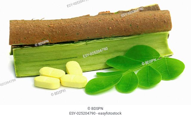 Moringa leaves and bark with pills