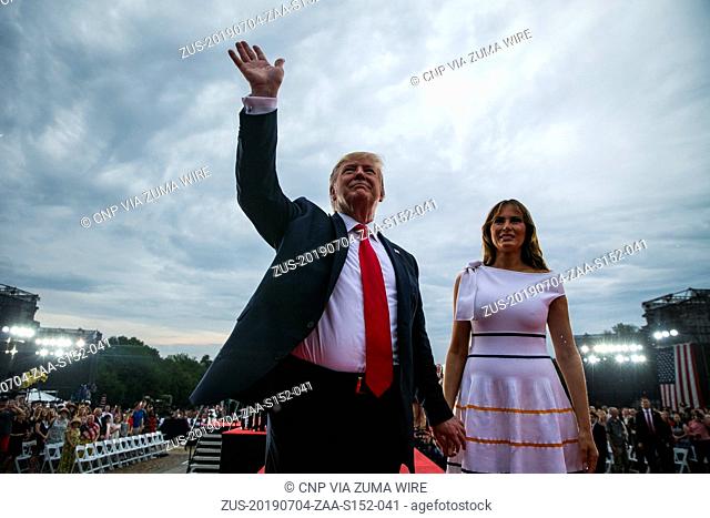July 4, 2019, Washington, District of Columbia, USA: U.S. President DONALD TRUMP waves with First Lady MELANIA TRUMP during the Fourth of July Celebration...