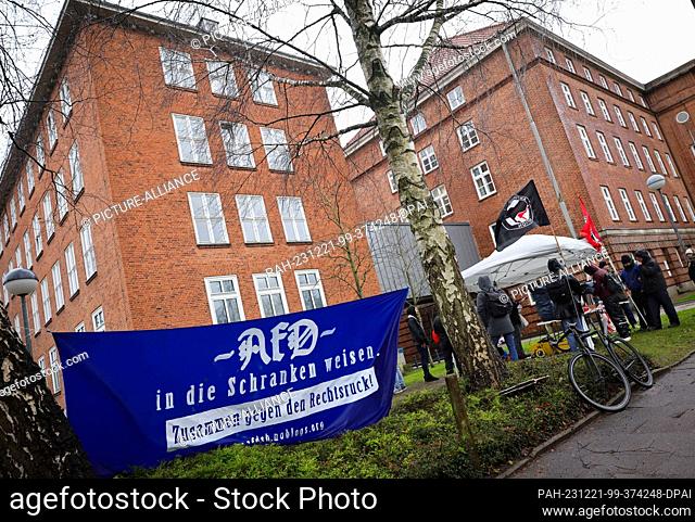 21 December 2023, Schleswig-Holstein, Kiel: Protesters stand in front of Kiel district court. The verdict is expected on Thursday at Kiel District Court in a...