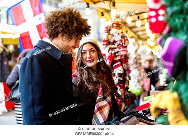 Happy young couple at Christmas market