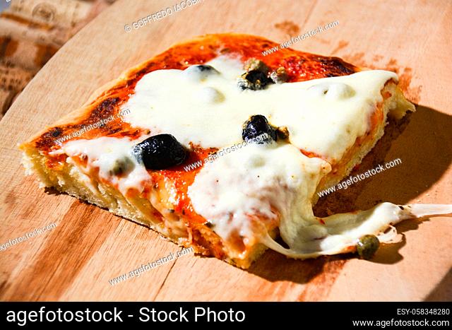 pizza stuffed with olives and Italian tomatoes