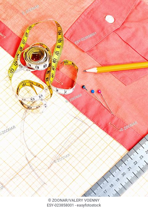 pattern, measuring tape, pencil, pins, red blouse