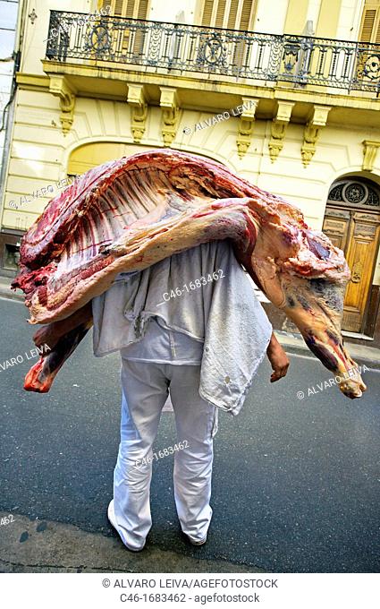 Butcher with a cow, Buenos Aires, Argentina