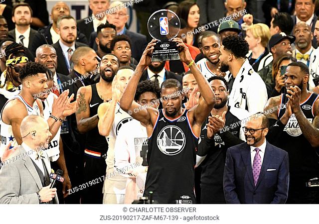 February 17, 2019 - Charlotte, NC, USA - Team LeBron's Kevin Durant, of the Golden State Warriors, raises the MVP trophy after the 2019 NBA All-Star 2019 game...