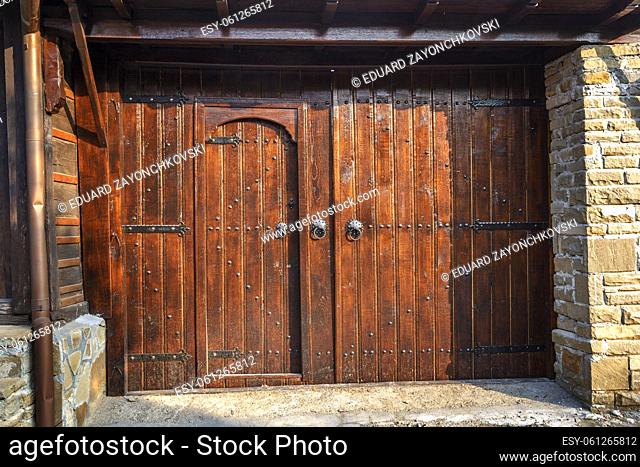 Old vintage wooden door ornate with a beauty metal furniture