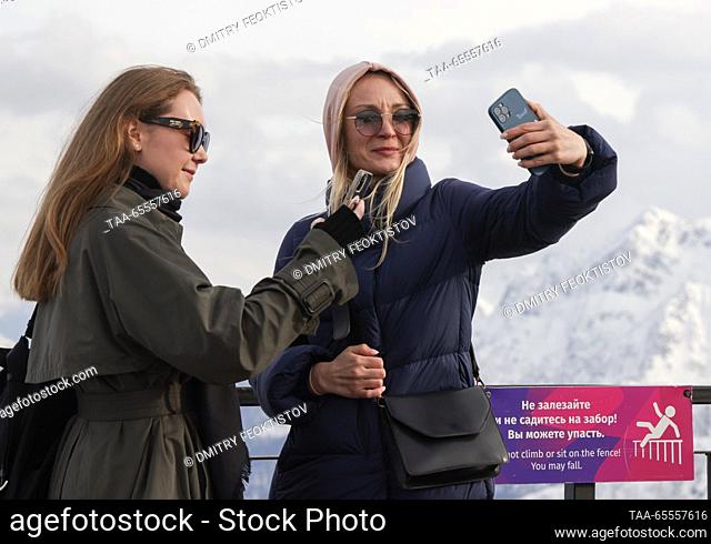 RUSSIA, SOCHI - DECEMBER 8, 2023: Two women make a selfie at the Rosa Khutor mountain resort. Dmitry Feoktistov/TASS