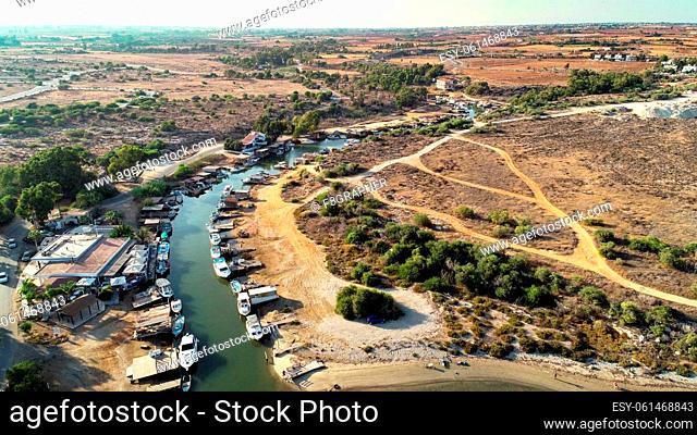 Aerial bird's eye view of Liopetri river to the sea (potamos Liopetriou), Famagusta, Cyprus. A landmark tourist attraction fishing village