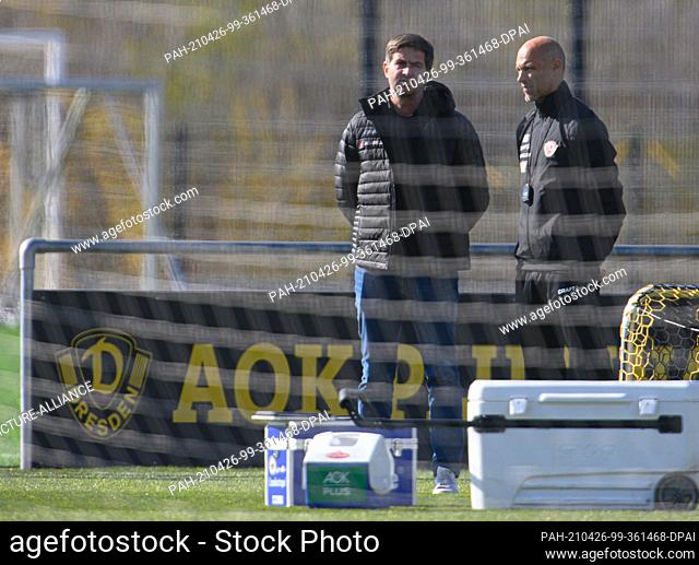 26 April 2021, Saxony, Dresden: Football: 3rd division, Alexander Schmidt (r), new coach of SG Dynamo Dresden, stands with sports director Ralf Becker during...
