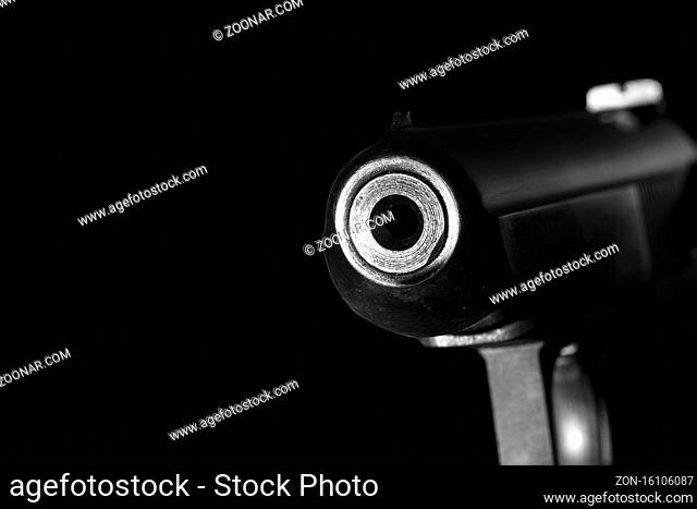 Gun barrel close up on black background.Shooting weapon