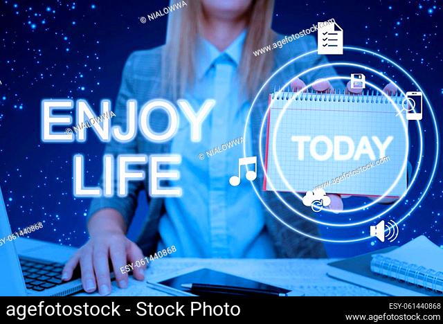 Text sign showing Enjoy Life, Internet Concept Any thing, place, food or person, that makes you relax and happy Lady in suit holding notepad representing...
