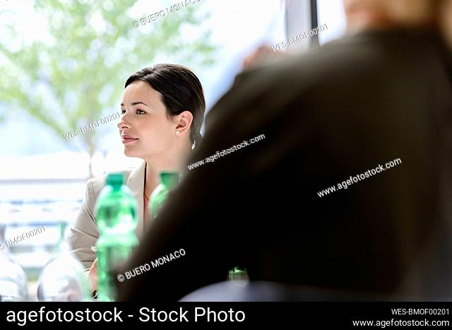 Attentive businesswoman sitting meeting, listening focussed
