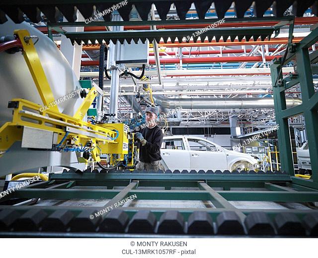 Car Plant Worker With Machinery