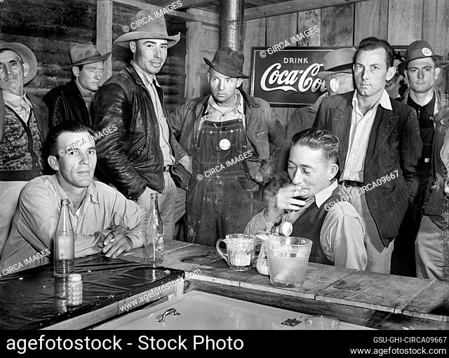 Construction Workers from Camp Livingston U.S. Military Base eating and hanging around new Cafe, Alexandria, Louisiana, USA, Marion Post Wolcott, U.S