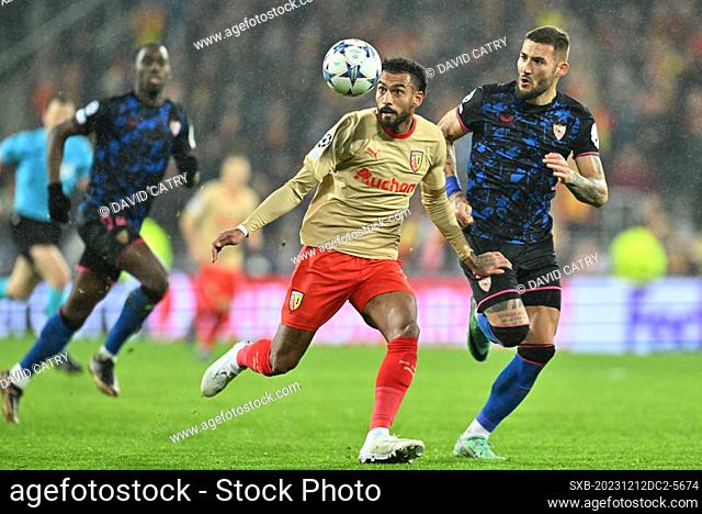 Angelo Fulgini (11) of RC Lens fighting for the ball with Nemanja Gudelj (6) of Sevilla during the Uefa Champions League matchday 6 game in group B in the...