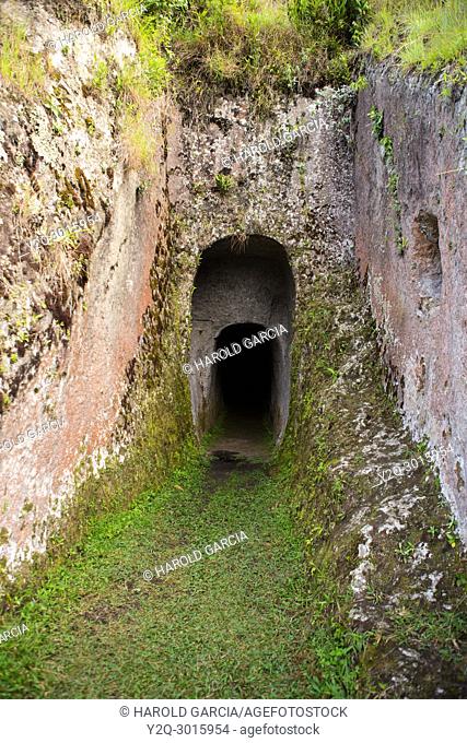 Entrance to indian cave in La Piramide. Tierradentro National archeological park. Department of Cauca, Colombia