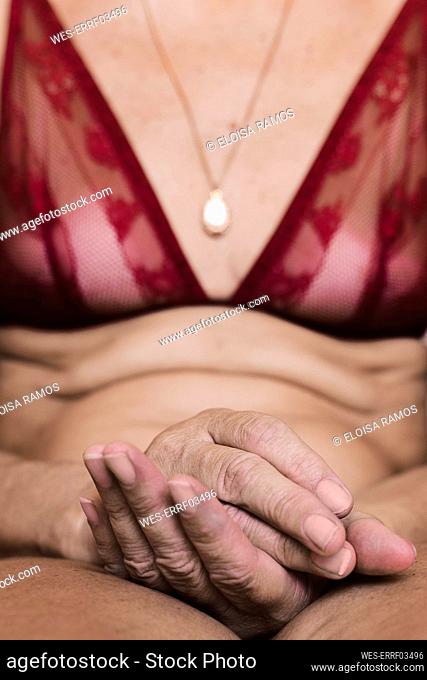 Close-up of a senior woman wearing a bra