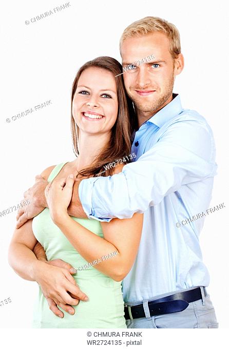 Portrait of a Happy Young Couple Smiling Looking - Isolated on White